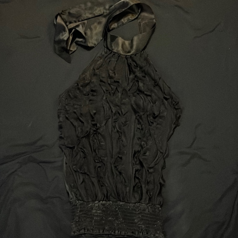 Ruffle front black blouse. Ties around neck and stretchy at the bottom. Size S